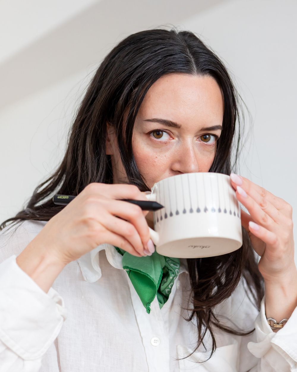 Zoey Reinach drinking from a mug